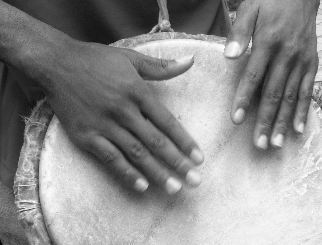 Drum with hands on it